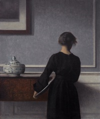 Interior with Young Woman Seen from the Back (c. 1903–04) by Vilhelm Hammershøi
